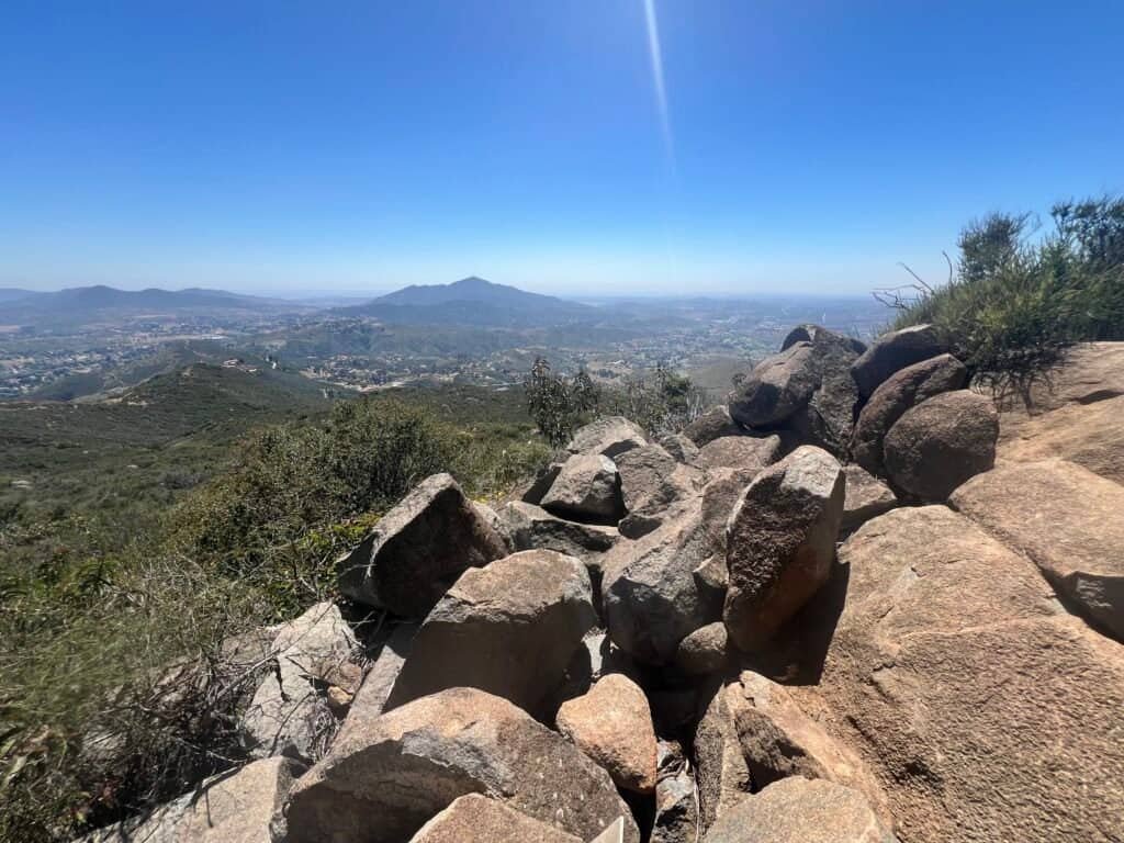 Rocky summit area at McGinty Mountain overlooking rolling hills and valleys in eastern San Diego County.