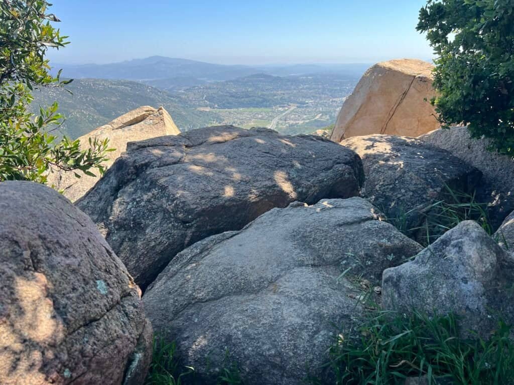 Rock outcrop at Stanley Peak overlooking Escondido and the surrounding hills at Daley Ranch in California.