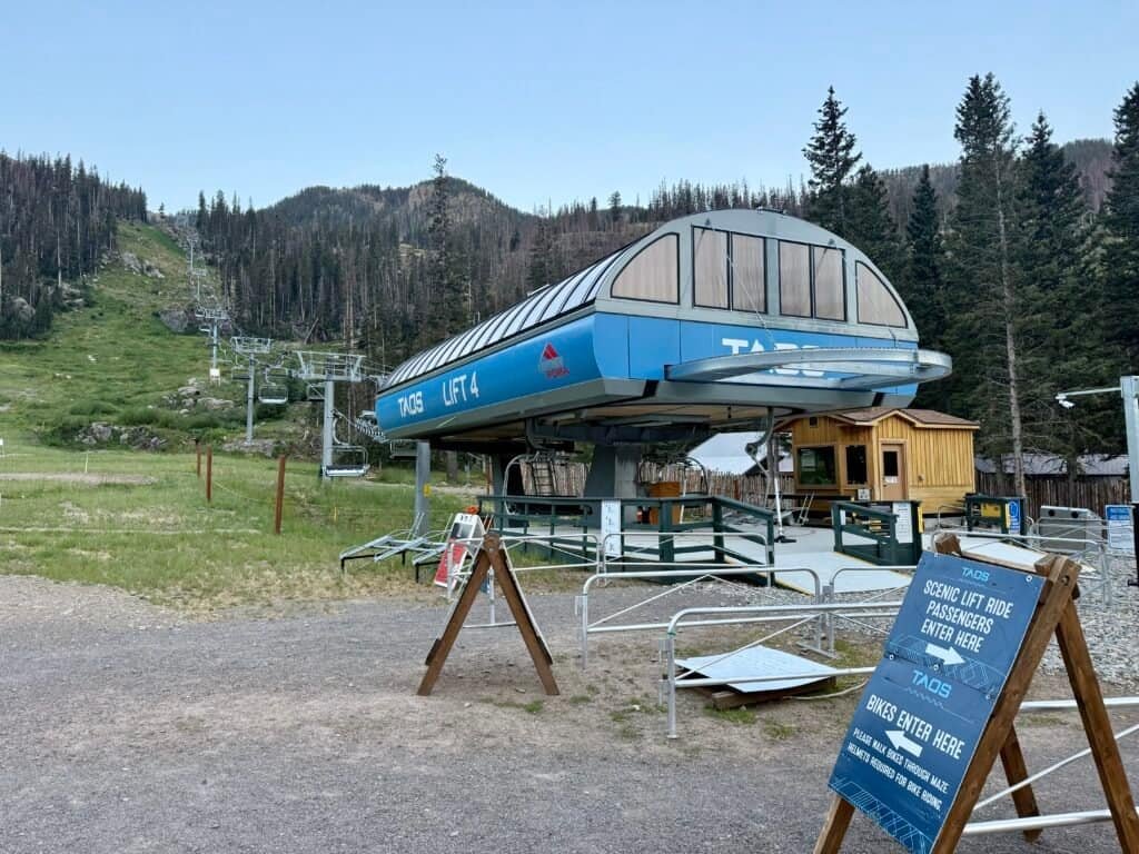 Taos Ski Valley Lift 4 with ski runs and mountains in the background near the start of the Wheeler Peak hike.