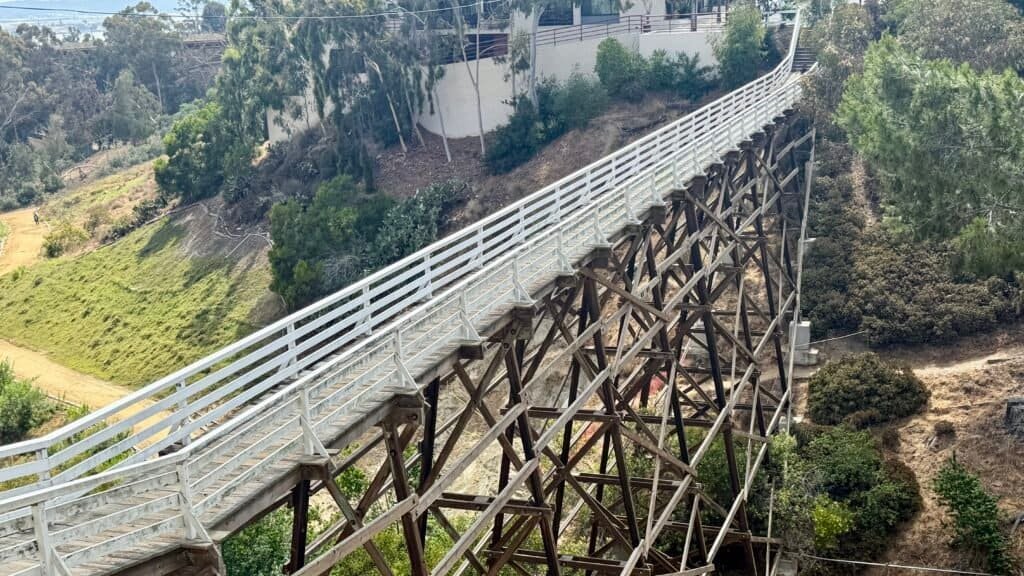 Side view of the wooden Quince Street Bridge spanning Maple Canyon in San Diego