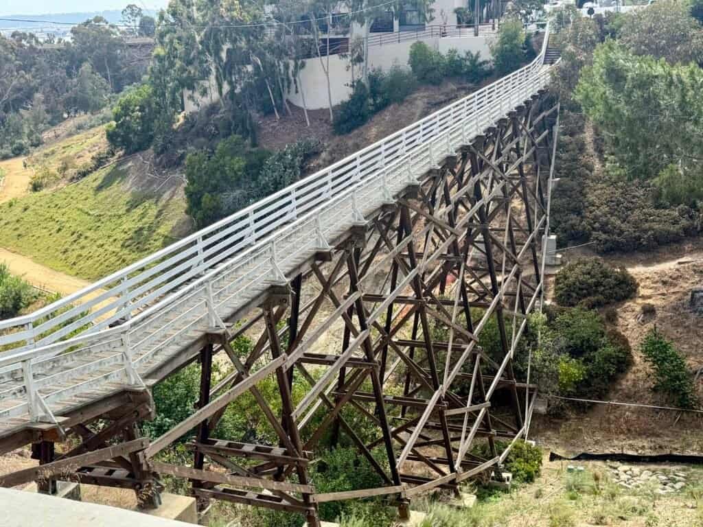 Side view of the wooden Quince Street Bridge spanning Maple Canyon in San Diego
