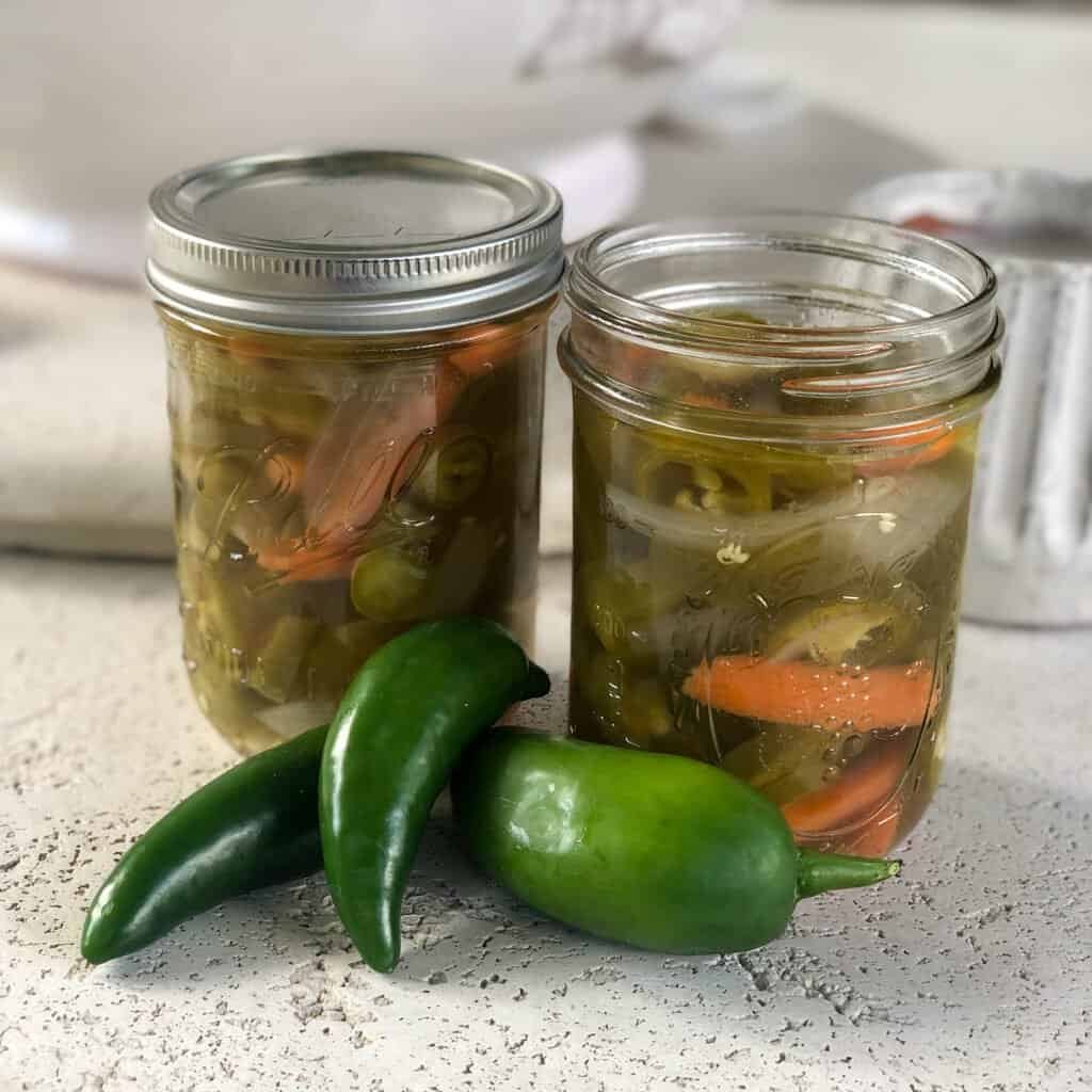 Jars of homemade pickled jalapeños made from homegrown peppers