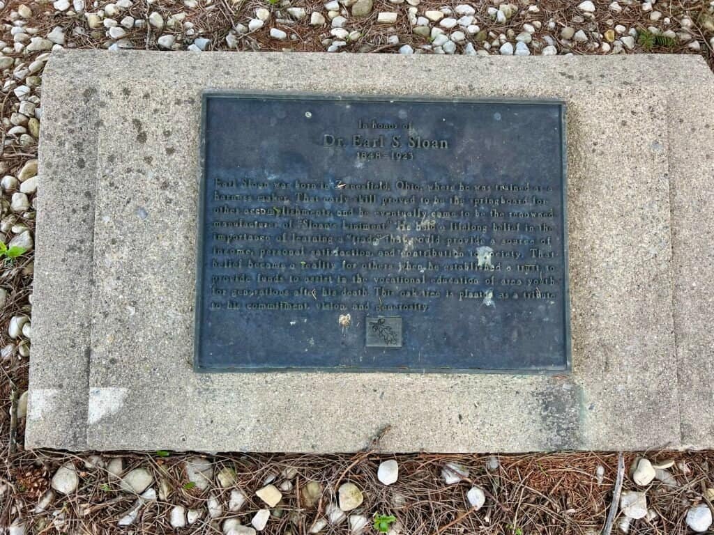 Plaque honoring Dr. Earl S. Sloan at Campbell Hill, recognizing his legacy and connection to Ohio’s highest point