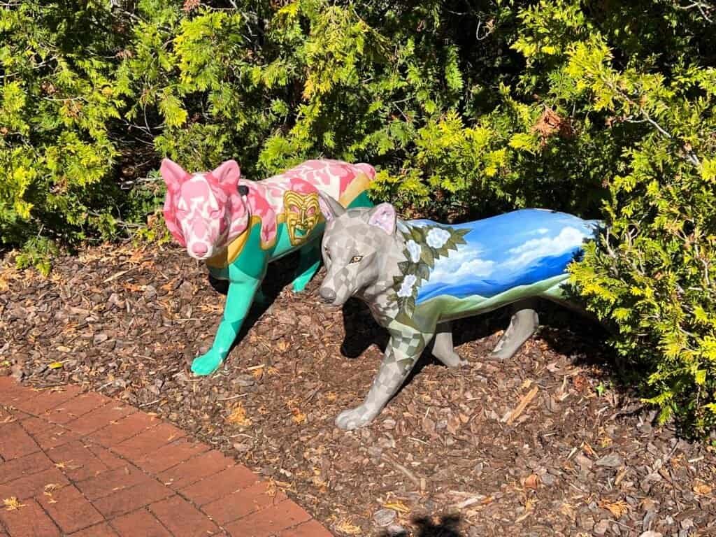 Colorful painted wolf sculptures as part of a public art installation in Abingdon, Virginia.