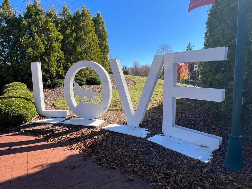 LOVE sign installation in Abingdon, Virginia, with wolf silhouette inside the letter O.
