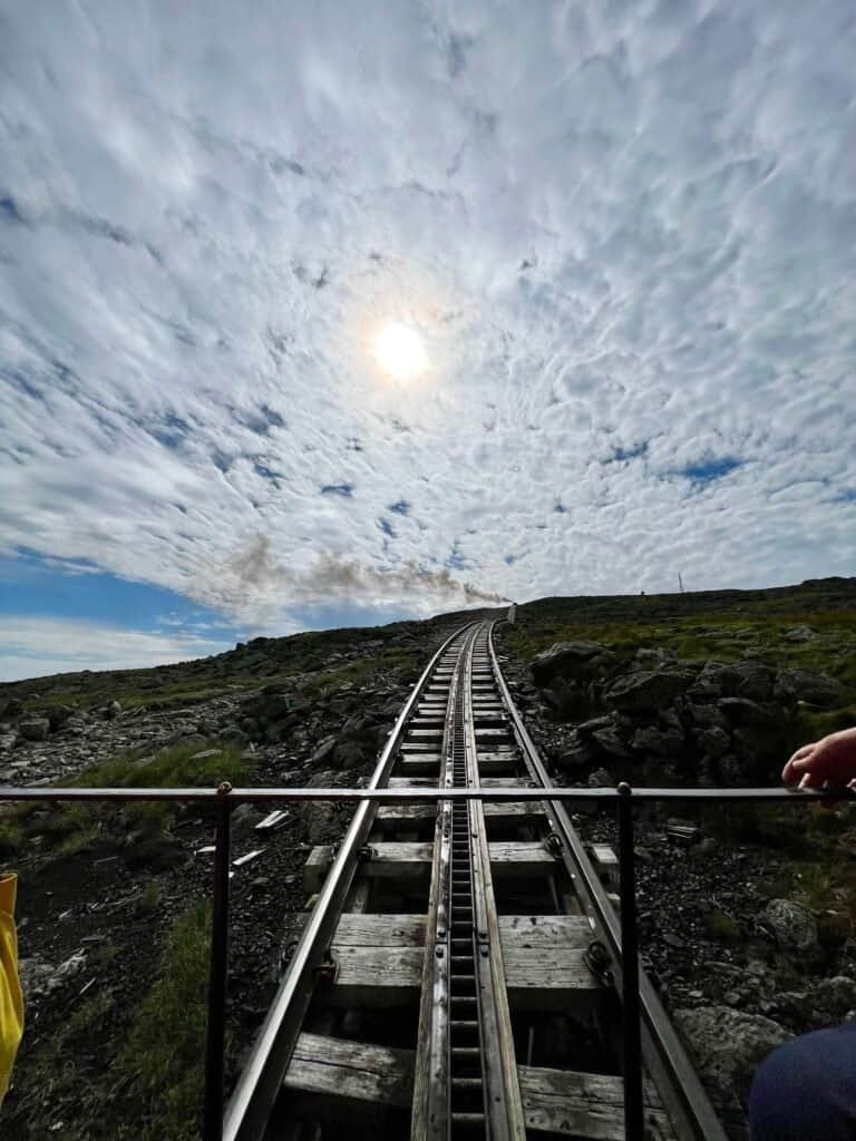 View up Jacob’s Ladder, the steepest section of the Mount Washington Cog Railway, climbing toward the summit.