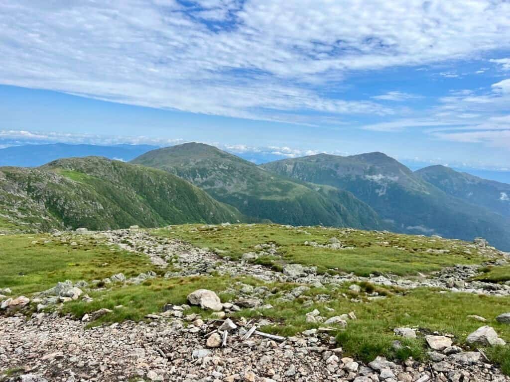 View of the Presidential Range and alpine terrain as the Mount Washington Cog Railway climbs toward the summit.