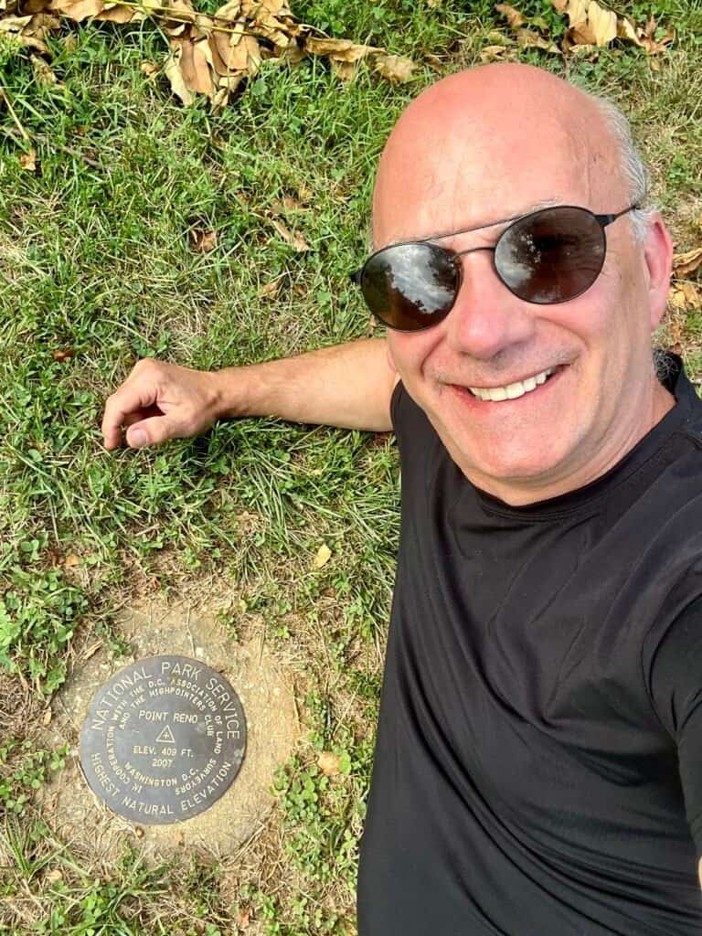 Author at the Point Reno survey marker, Washington, D.C.
