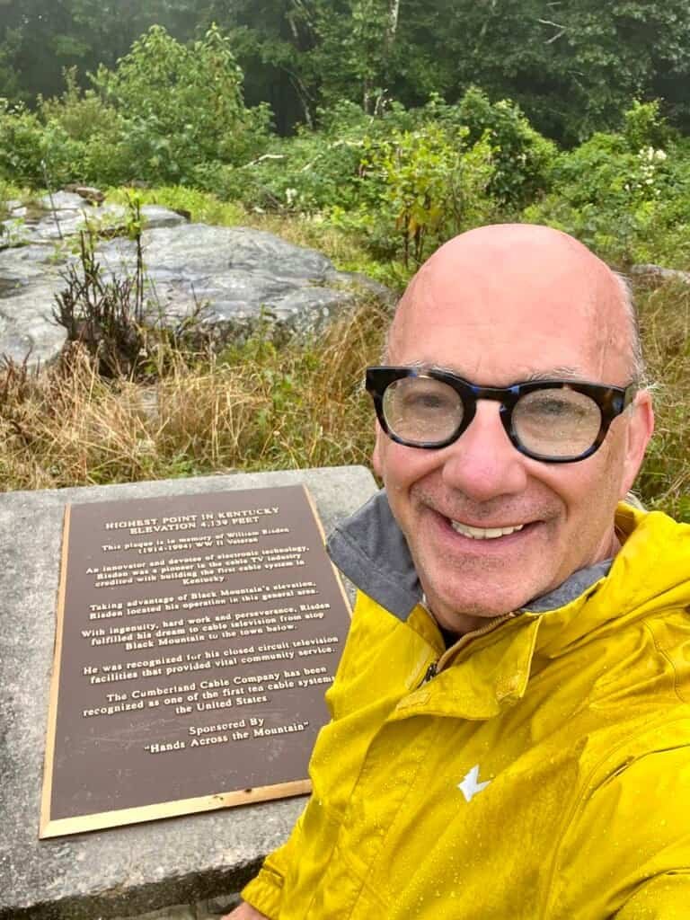 Stephen at the Black Mountain summit plaque, Kentucky’s highest point, in light rain