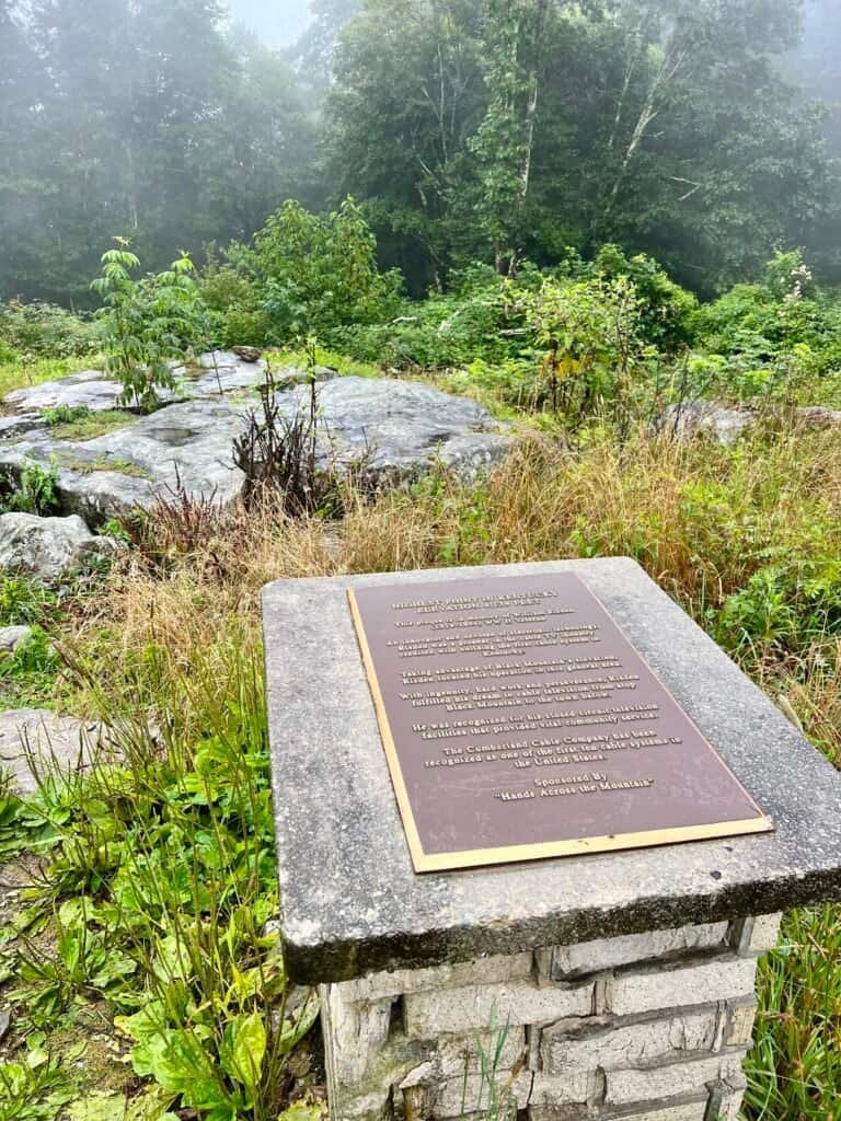 Summit monument and boulder marking the highest point in Kentucky on Black Mountain