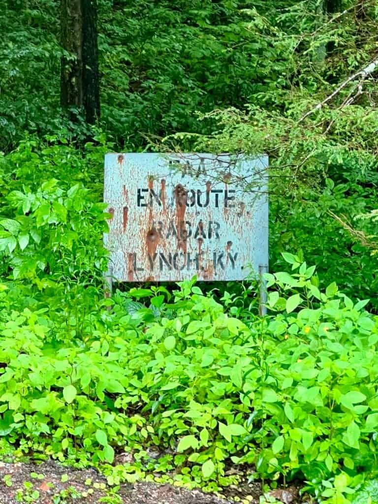 FAA warning sign marking the entrance to Black Mountain Ridge Road near the summit