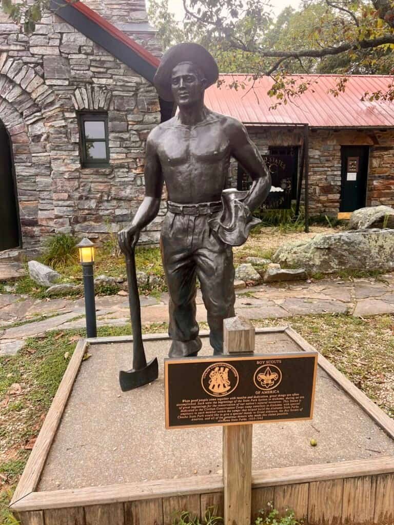 Statue honoring the Civilian Conservation Corps at Cheaha State Park, depicting a CCC worker with tools.