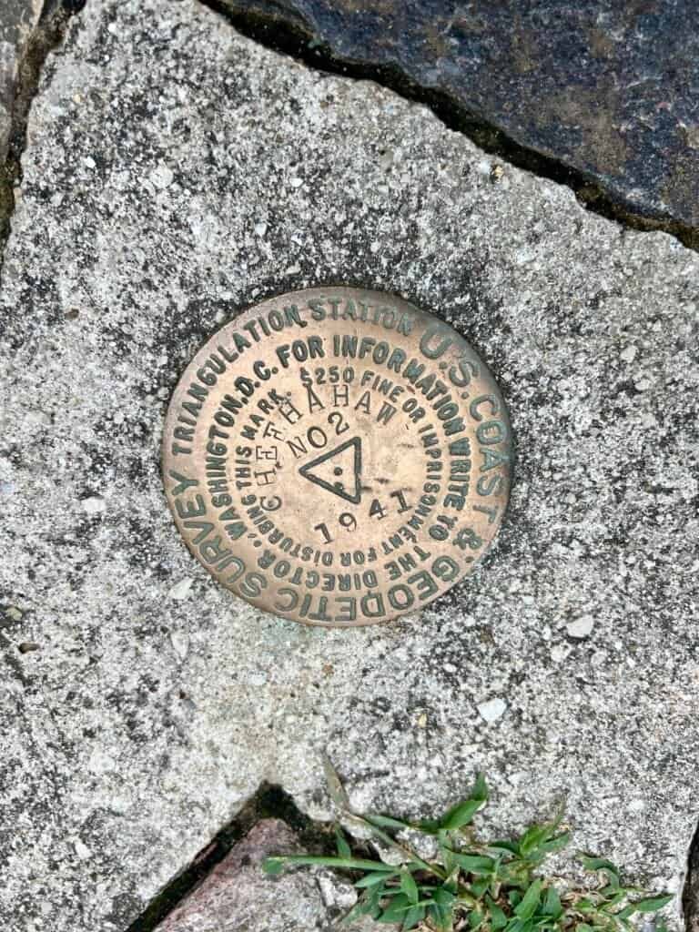 Close-up of U.S. Coast & Geodetic Survey triangulation station marker at Cheaha Mountain.