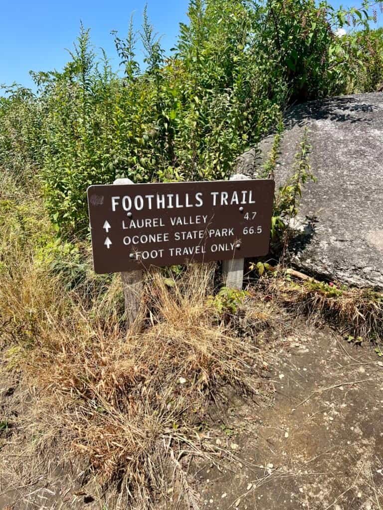 Foothills Trail sign showing distances near Sassafras Mountain before the second parking lot