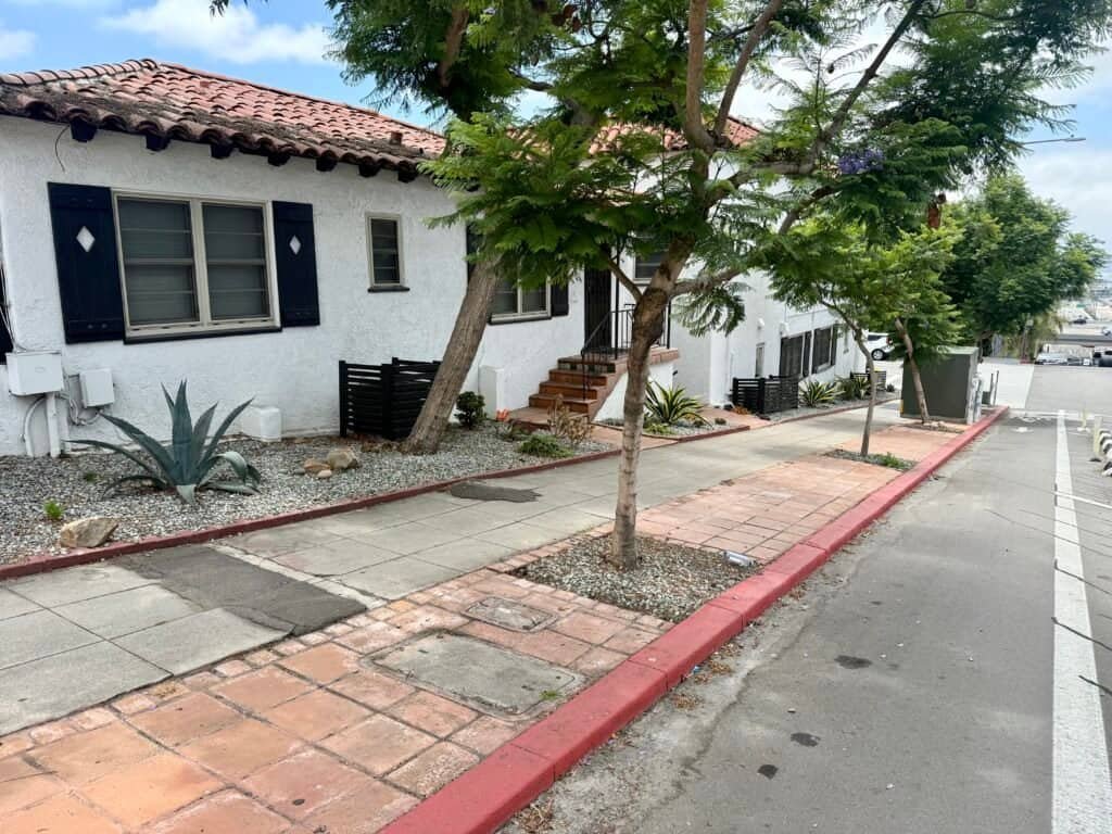 Exterior of the Top Gun filming location on Laurel Street in San Diego, a white stucco home with red tile roof