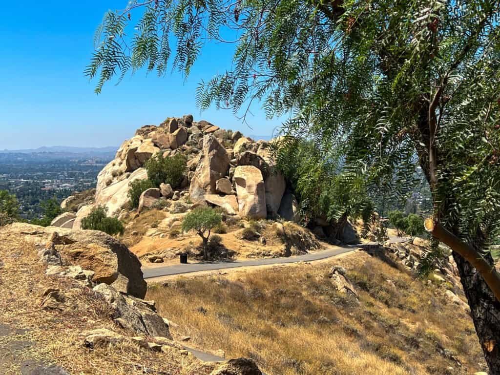 Paved walking trail winding through rocky hills at Mount Rubidoux