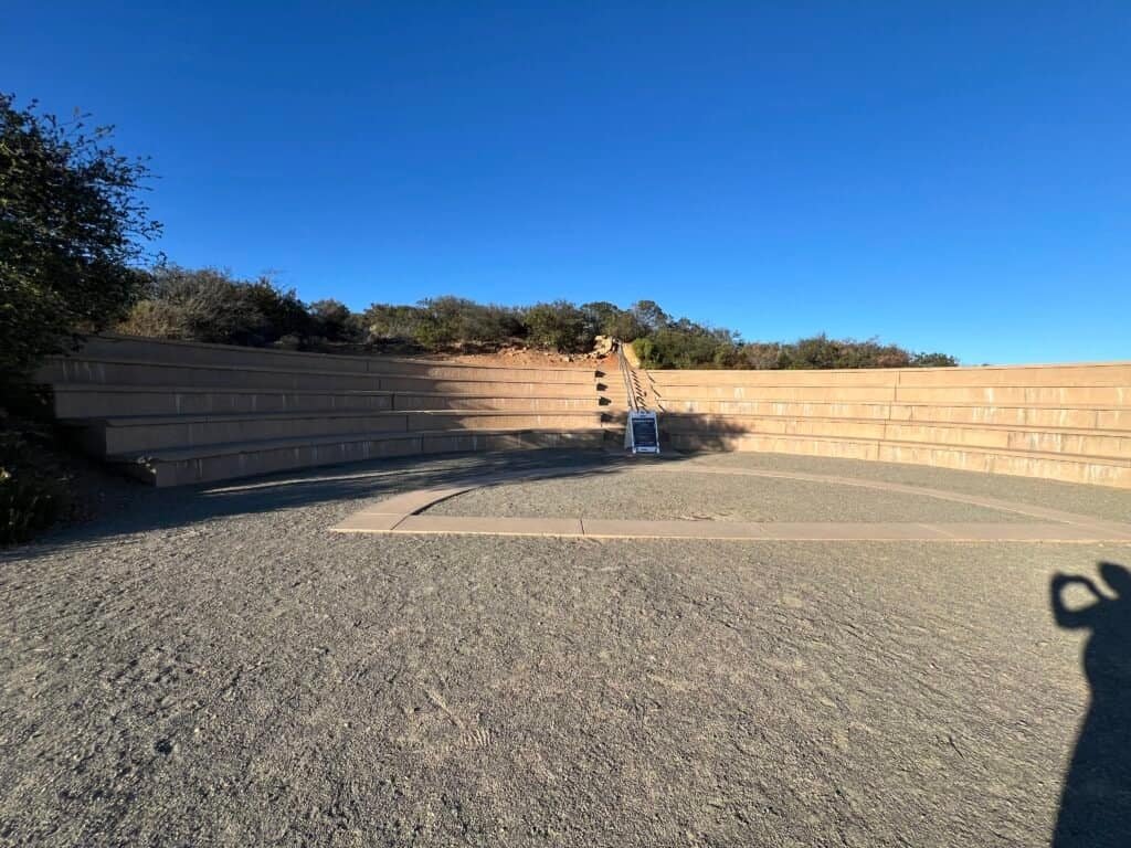 Mahnita Boyden-Wofford Amphitheater at Double Peak Park in San Marcos, California, with tiered seating and a sign for a stargazing event.