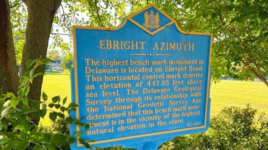 Historical marker for Ebright Azimuth, Delaware’s highest point, showing elevation and benchmark details