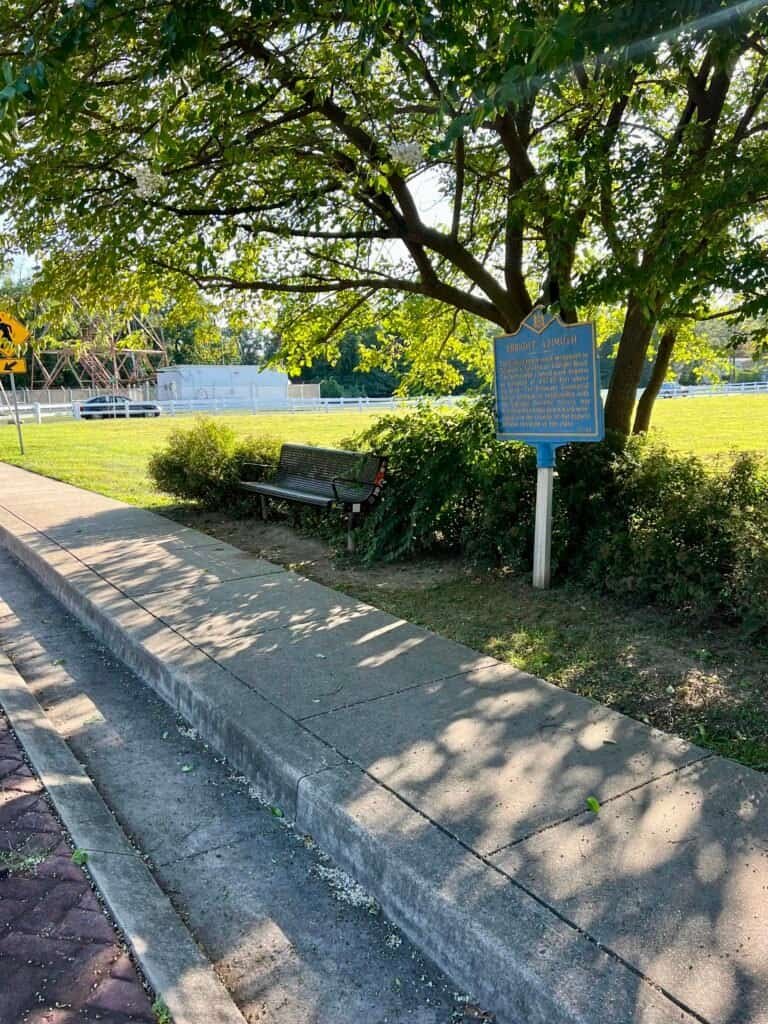 Ebright Azimuth historical marker set along a sidewalk near the Delaware–Pennsylvania border