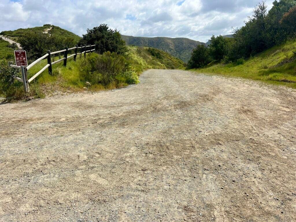 Wide downhill trail branching off Fortuna Saddle Trail in Mission Trails Regional Park