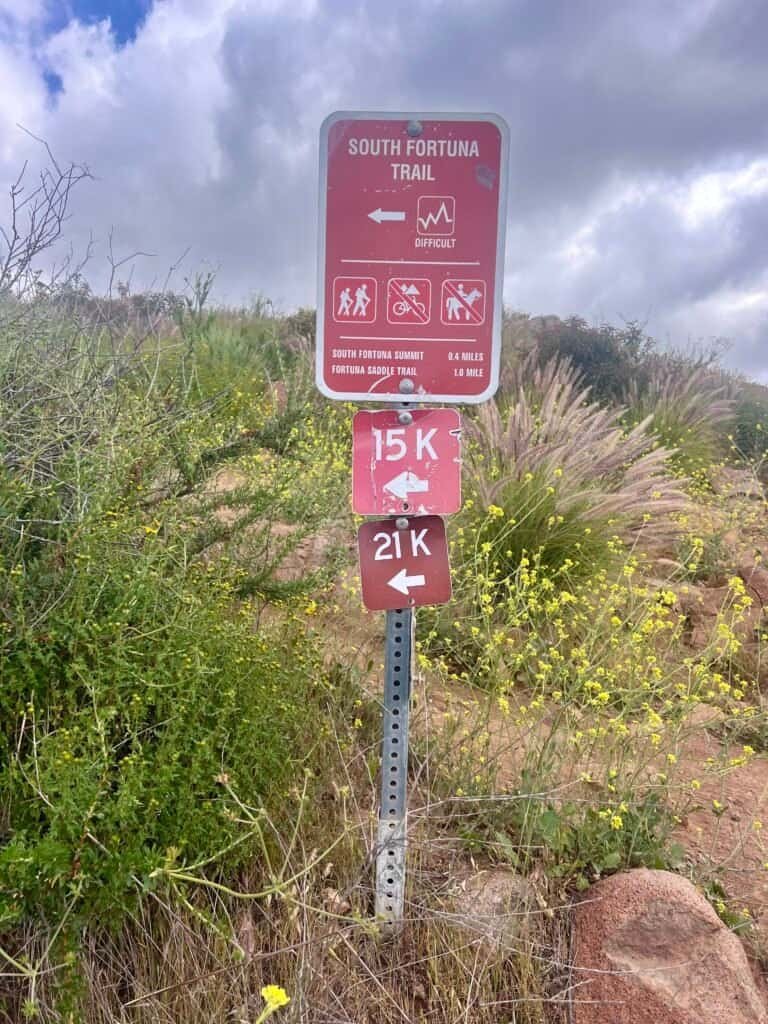 View from the top of the South Fortuna stairs showing rolling hills and the trail continuing toward the summit.