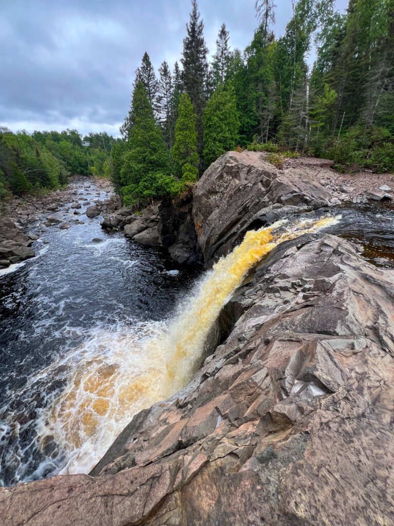 Illgen Falls cascading over rock ledges on the Baptism River in Tettegouche State Park, Minnesota.