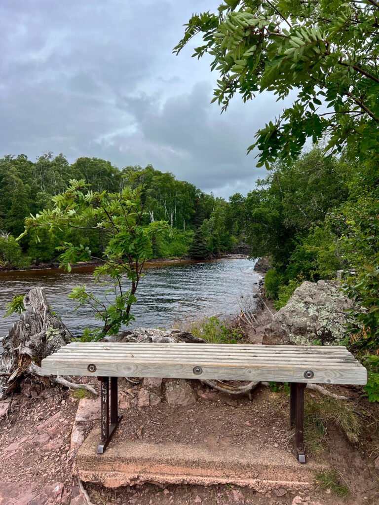 Bench overlooking the Baptism River near its mouth at Tettegouche State Park.