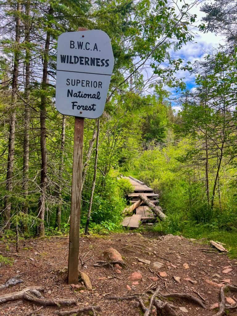 Boundary Waters Canoe Area Wilderness sign marking entry into Superior National Forest along the Eagle Mountain trail.