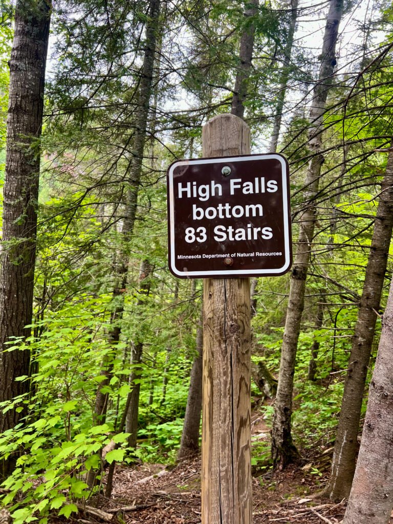 Trail sign showing 83 stairs to the bottom of High Falls in Tettegouche State Park, Minnesota.
