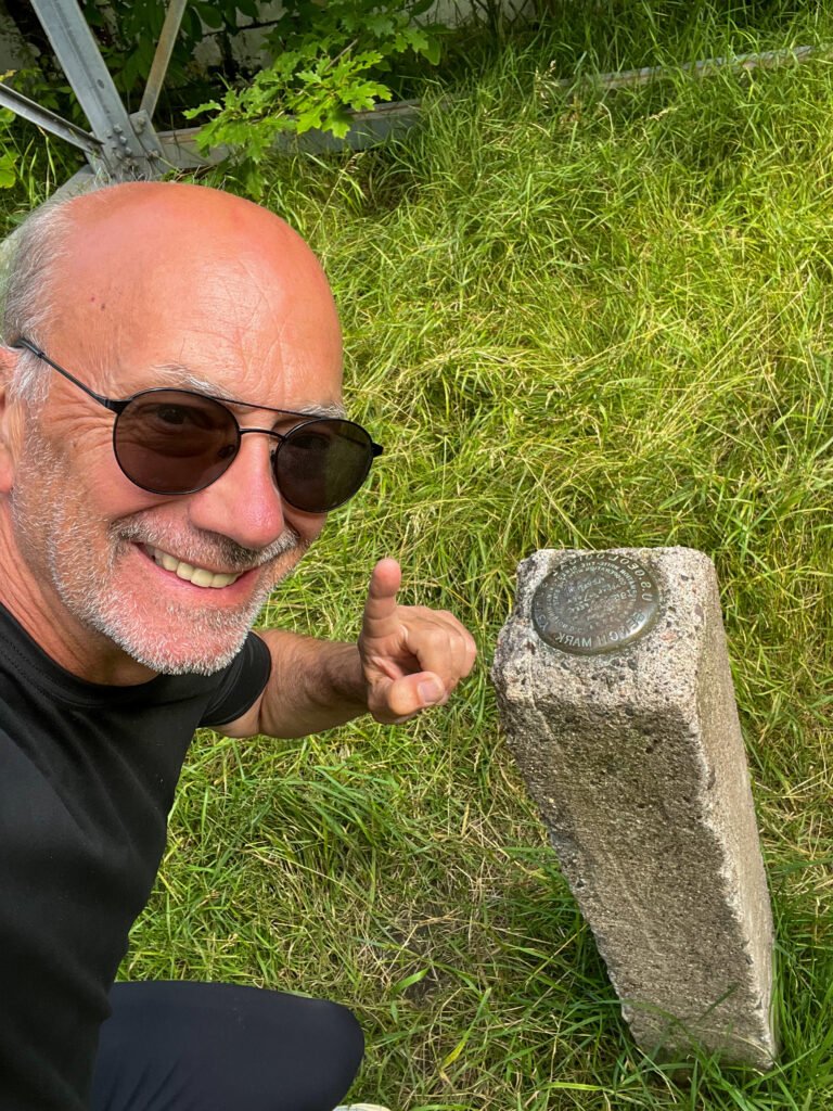 Summit selfie at Timms Hill high point next to the USGS benchmark in Wisconsin.