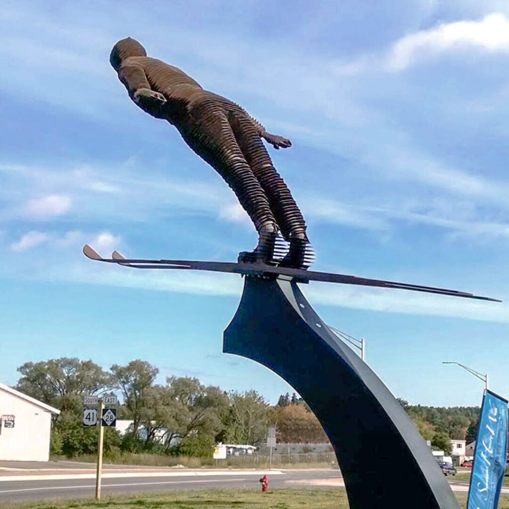 Ski jumper statue outside the U.S. Ski and Snowboard Hall of Fame in Ishpeming, Michigan.
