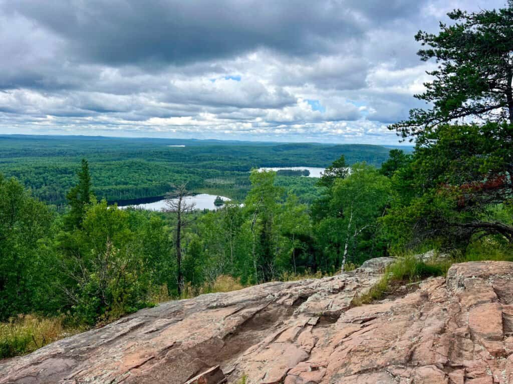View from Eagle Mountain Overlook showing forested landscape and lakes within the Boundary Waters Canoe Area Wilderness in northeastern Minnesota.