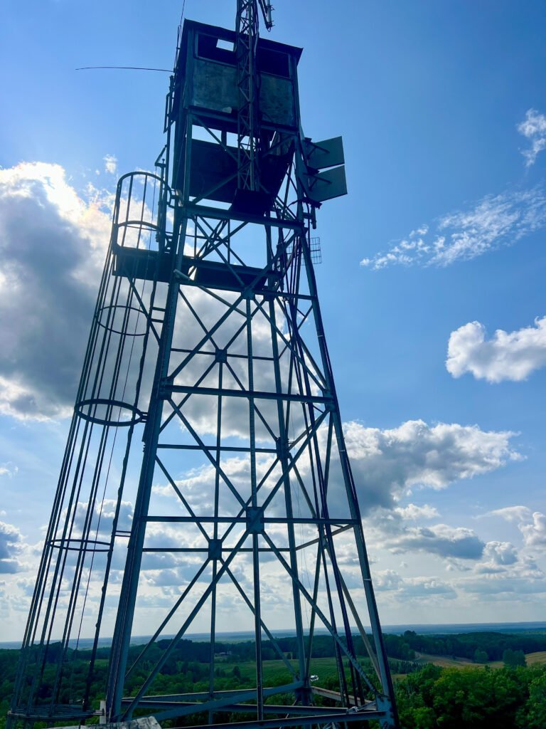 Fire tower structure rising above the observation platform at Timms Hill summit in Wisconsin.