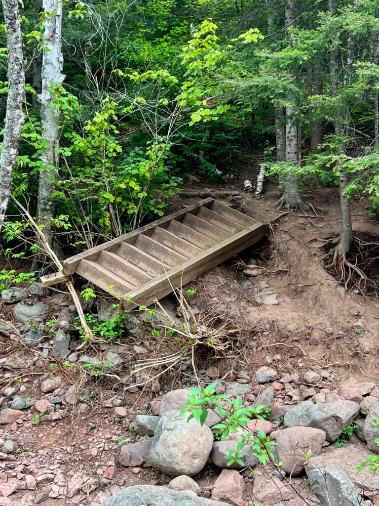 Collapsed wooden trail stairs along the Two Step Falls trail in Tettegouche State Park.