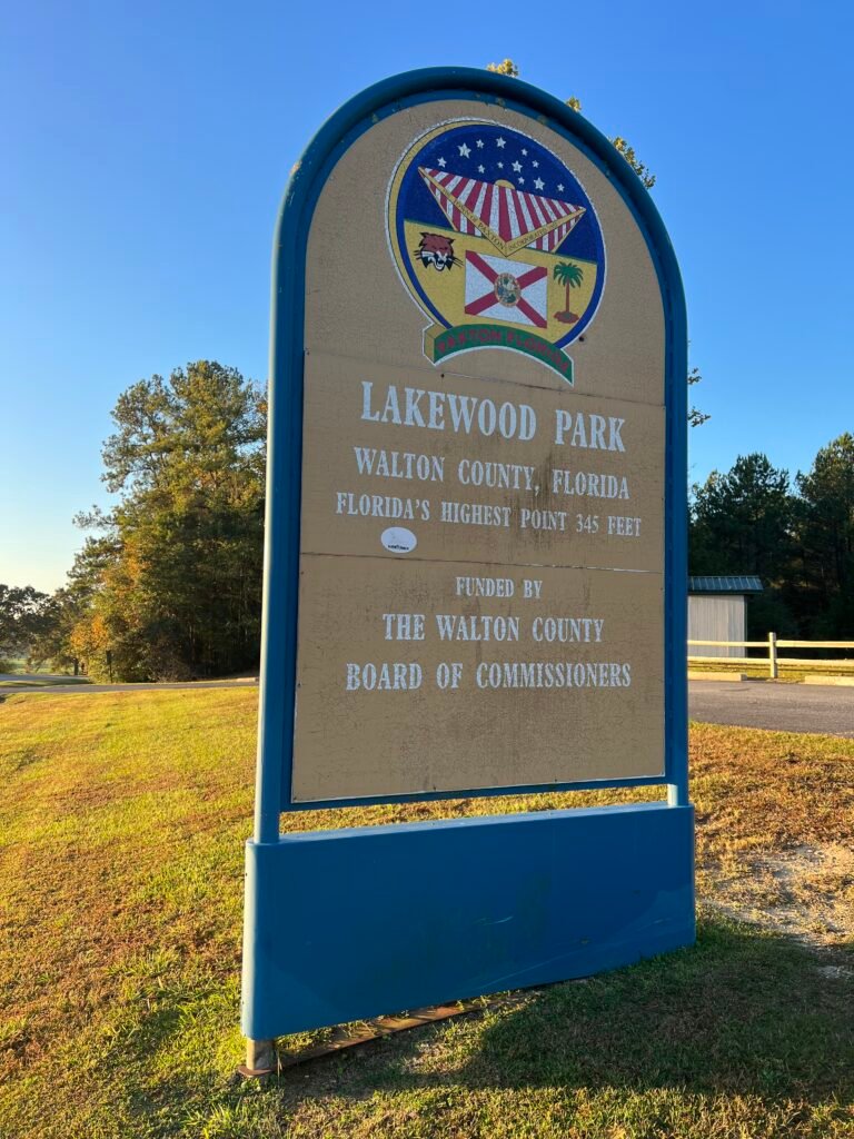 Lakewood Park sign on County Road 285 marking Florida’s highest point at 345 feet in Walton County.