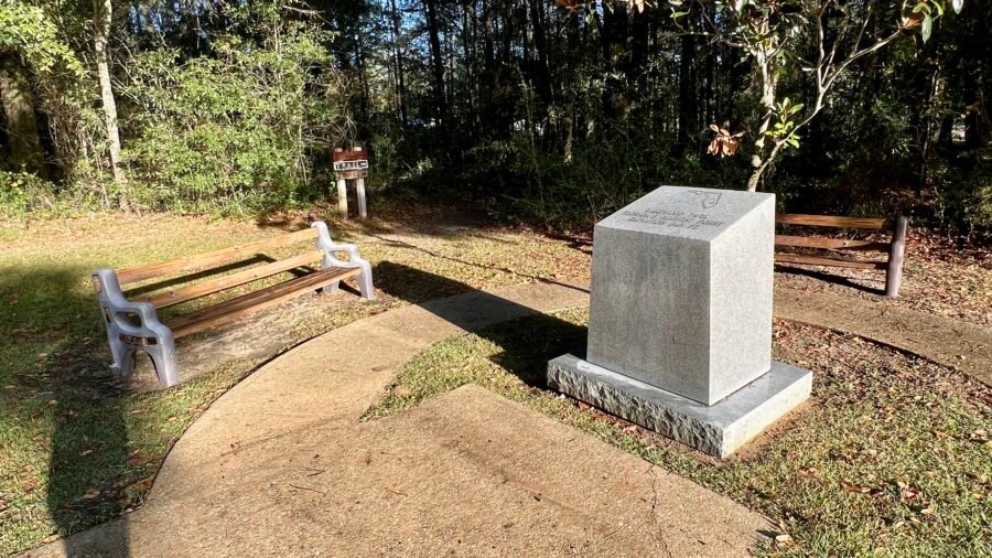 Britton Hill high point monument and Highpointers Club bench in Lakewood Park, Florida.
