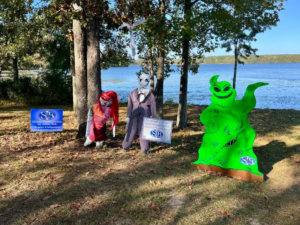 Halloween-themed scarecrows by the lake at Frank Jackson State Park in Opp, Alabama