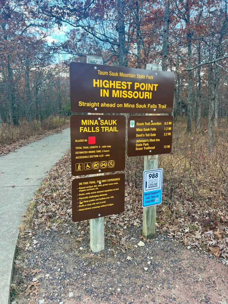 Trailhead sign for Taum Sauk Mountain State Park marking the highest point in Missouri along Mina Sauk Falls Trail