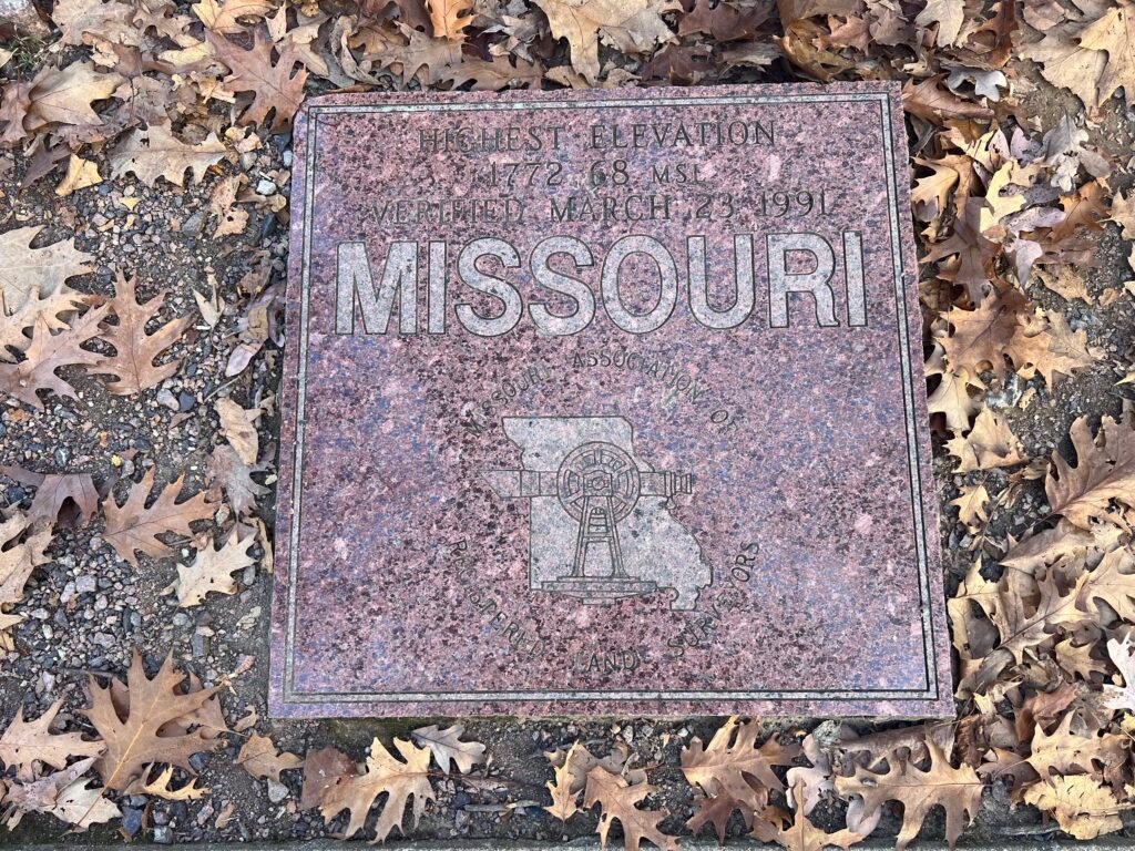 Granite high point marker for Missouri at Taum Sauk Mountain State Park showing 1,772 feet elevation.