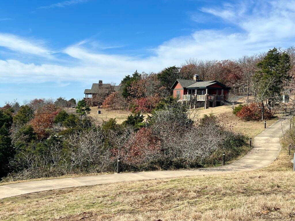 Mountain cabins along the bluff at Mount Magazine State Park with autumn trees and valley views.