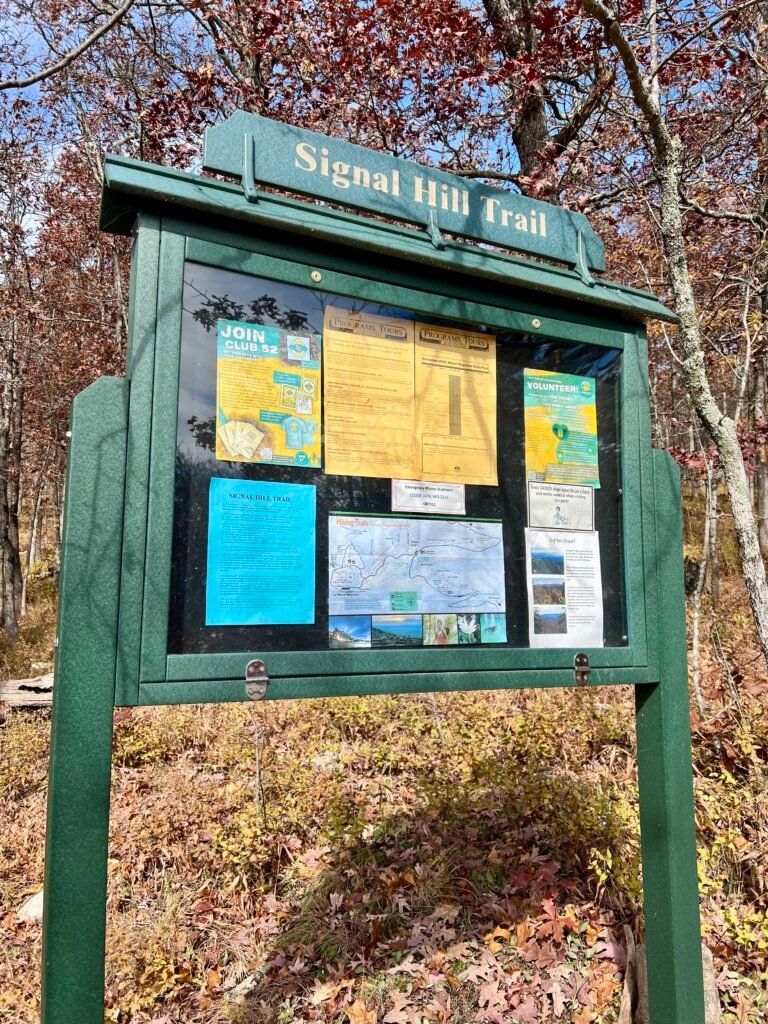 Signal Hill Trail bulletin board with map, program notices, and hiking information.