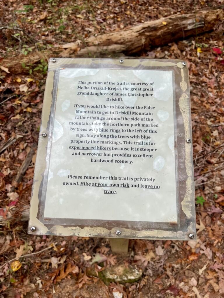 Interpretive sign along the Driskill Mountain trail honoring Melba Driskell-Krejsa and explaining the alternate route over False Mountain.