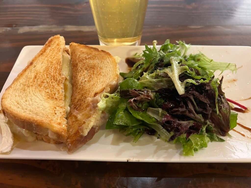 Pear and brie grilled sandwich with side salad at Barrel 33