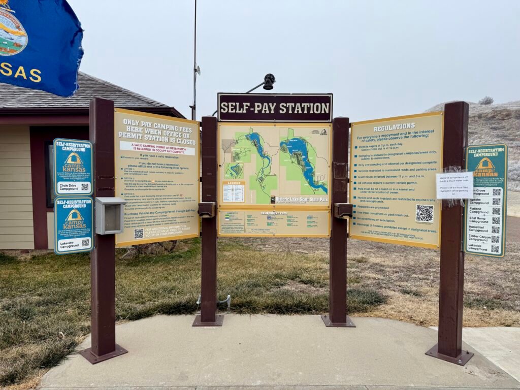 Self-pay station and campground registration board at Historic Lake Scott State Park in Kansas.