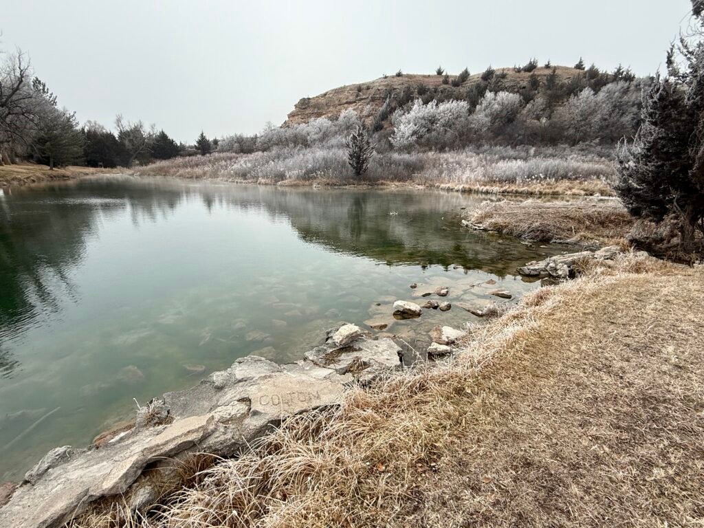 Clear spring water and limestone bluff near Big Springs at Lake Scott in winter.