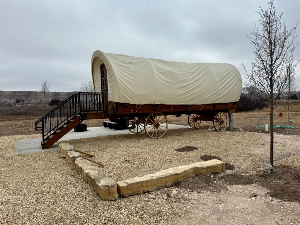 Replica covered wagon stagecoach on display near El Cuartelejo in western Kansas.