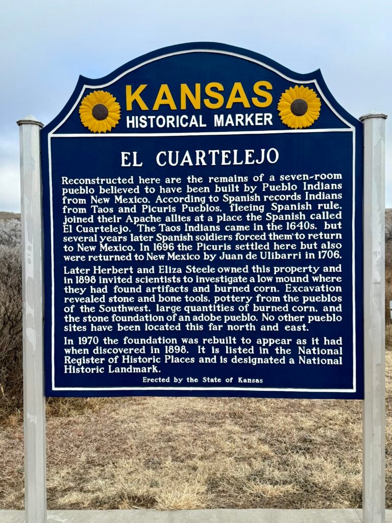 Blue Kansas Historical Marker sign explaining the history of El Cuartelejo Pueblo ruins.