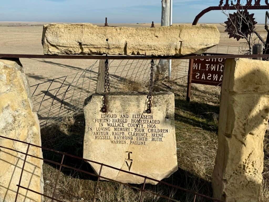 Commemorative stone honoring early settlers Edward and Elizabeth Harold at the Mount Sunflower summit in Kansas.