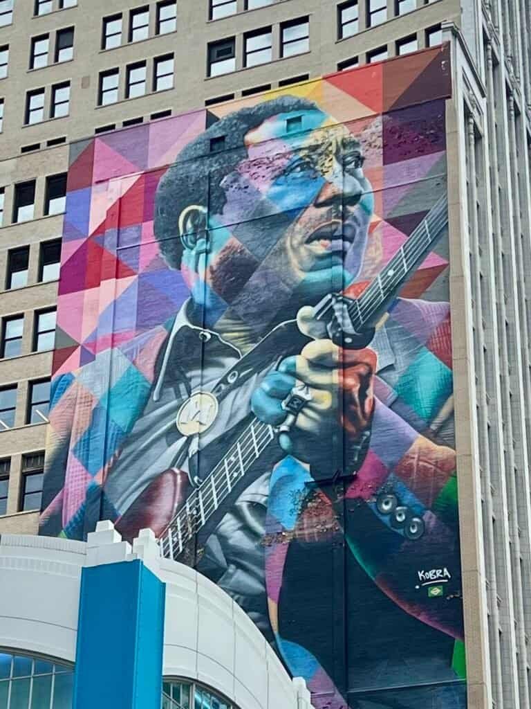 Colorful mural of B.B. King playing guitar on a downtown Chicago building