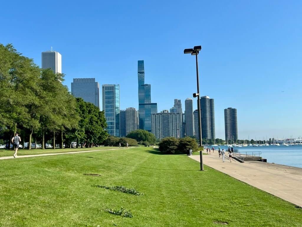 Morning run along Chicago’s Lakefront Trail with skyline and Lake Michigan on a clear summer day
